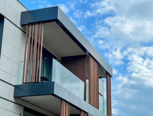 Modern apartment with glass railing on balcony