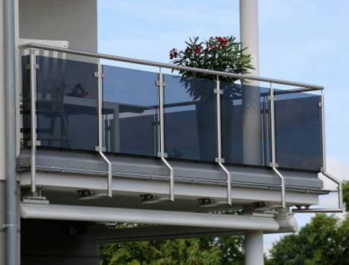 Balcony with glass railings and furnishings