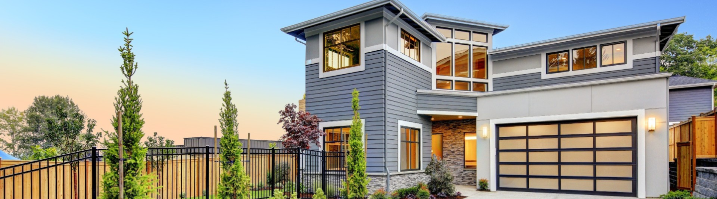 Contemporary home with large windows and glass features