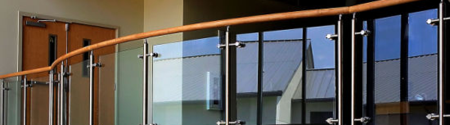 Glass railing with wooden handrail interior