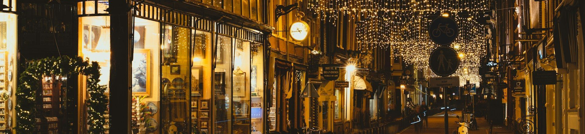 Alleyway of storefronts with items on display