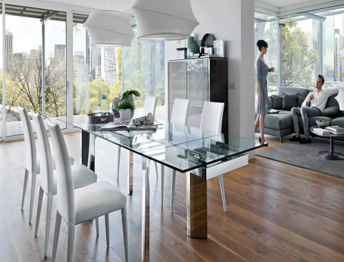 Dining room with glass tabletop overlooking a skyline view