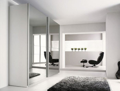 Modern office with large mirrors on wall