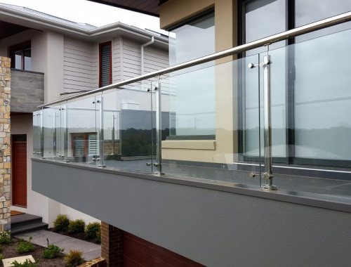 Apartment complex walkway balcony with glass railings