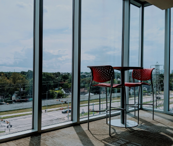 stools in front of large, expansive windows