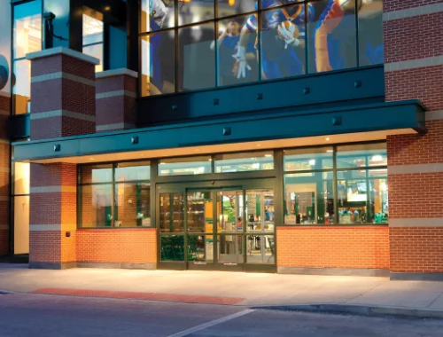 Storefront with windows illuminated at night