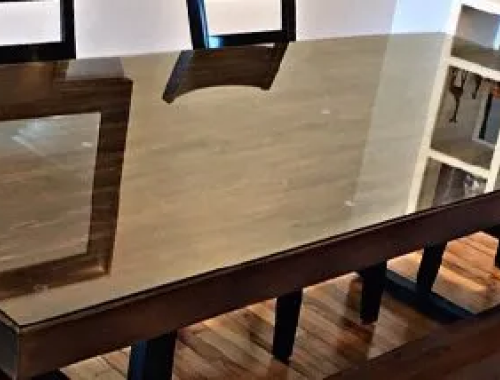 Wooden table with glass top