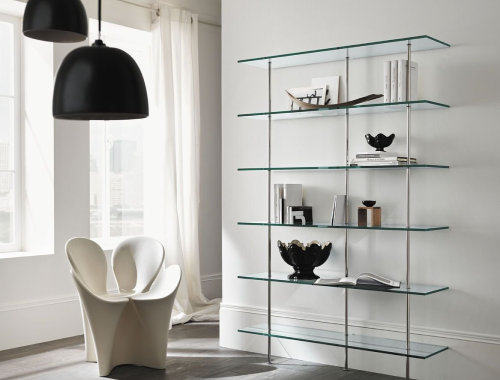 Seating area near glass shelves holding decorations