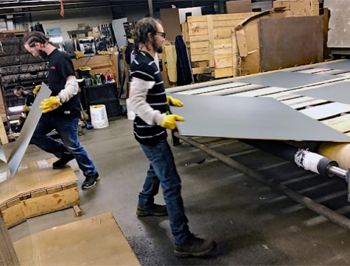 workers cutting mirrors